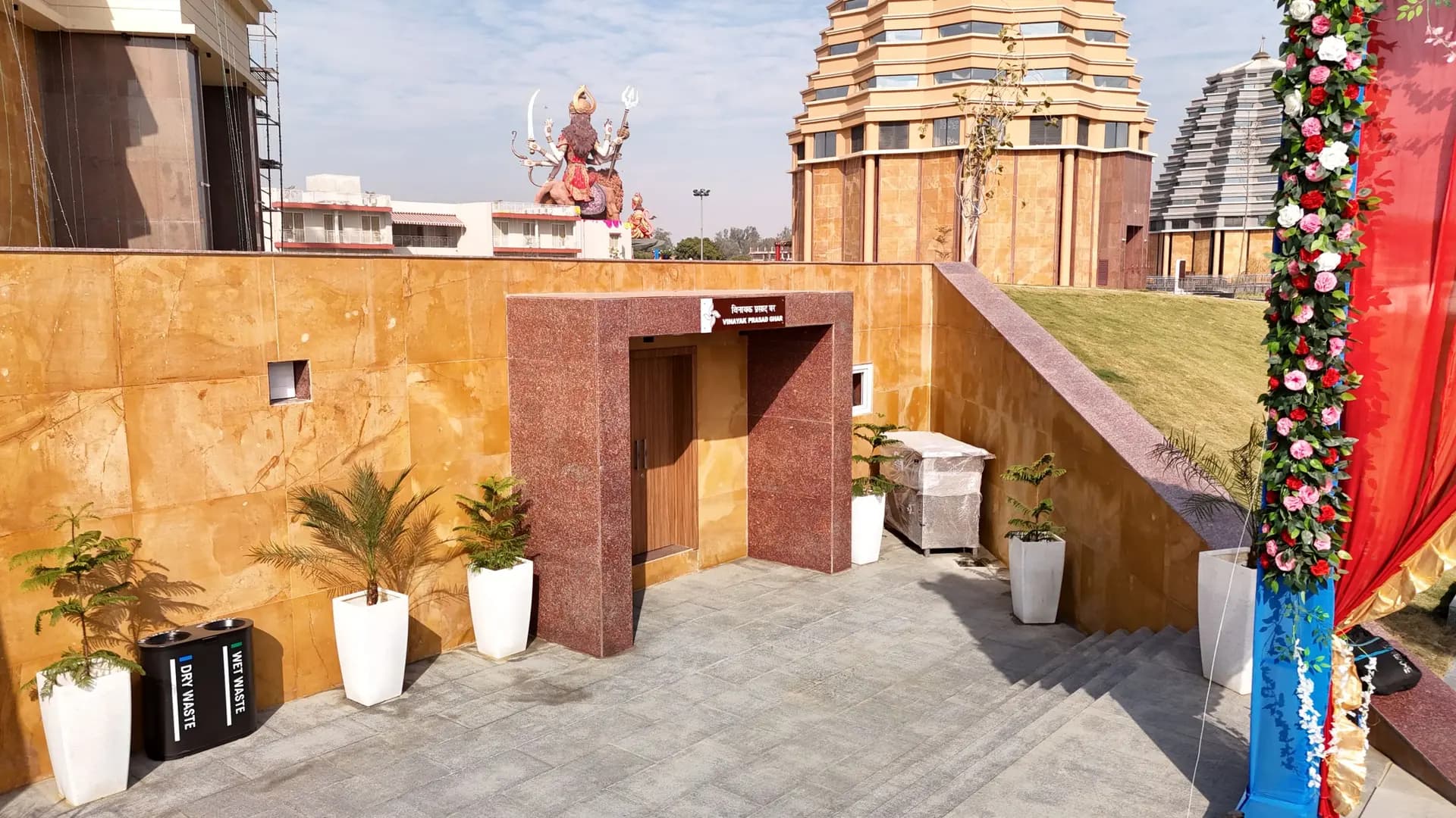 Vinayak Prasad Ghar at Chaar Dham Temple Vrindavan distributing sacred prasad.